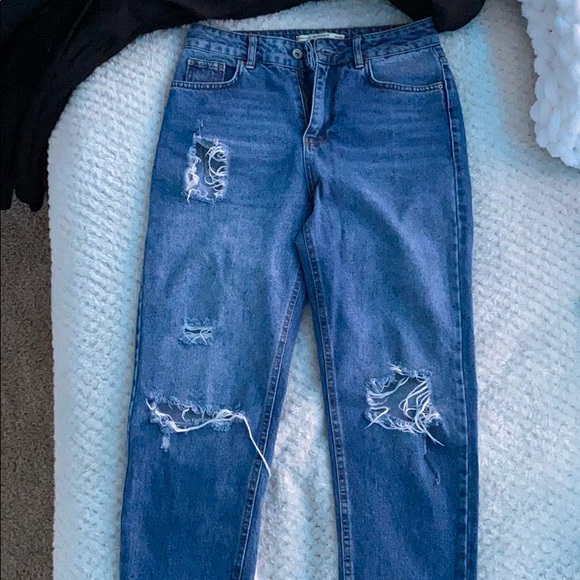 HIGH RISE RIPPED JEANS - Picture 1 of 6